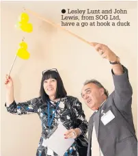  ??  ?? Lesley Lunt and John Lewis, from SOG Ltd, have a go at hook a duck