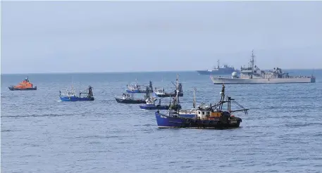  ?? Photo: Collins Dublin ?? A flotilla of vessels outside Skerries Harbour searches for a crew member from a fishing boat which sank.