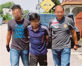 ?? OF THE POLICE
PIC COURTESY ?? A Puspakom technician was held in Klang recently. Page 1 pic: A suspect with links to the Islamic State was held in Kota Baru recently.