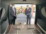  ?? BRYNN ANDERSON/AP ?? Mortician Cordarial O. Holloway, foreground left, funeral director Robert L. Albritten, foreground right, place a casket into a hearse in Dawson, Georgia, on April 18, 2020. In a poll conducted by The Associated Press-NORC Center for Public Affairs Research, about 1 in 5 Americans say they lost a relative or close friend to the coronaviru­s.