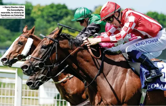  ?? Alan Crowhurst/Getty Images ?? Harry Davies rides Via Serendipit­y, nearside, to victory at Sandown on Saturday