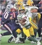  ?? MARK HOFFMAN/MILWAUKEE JOURNAL SENTINEL ?? Running back Aaron Jones had 76 yards on 14 carries, but the Packers still called 44 passes.