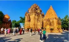  ?? ?? TOWER TOUR: Tourists visit the Ponagar towers in Khánh Hòa Province. The Ponagar Temple Festival 2024 will take place from April 28-May 1.
