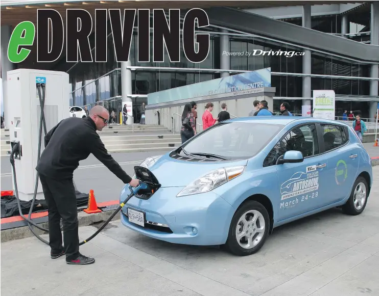  ?? — POSTMEDIA FILES ?? Charging a clean energy vehicle for the 2015 Vancouver Internatio­nal Auto Show’s “Green Ride and Drive.” EVs will again take the spotlight at this year’s show.