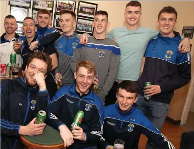 ??  ?? Members of the victorious St Pat’s senior football team celebratin­g their back-to-back county titles back at the clubhouse on Sunday night.