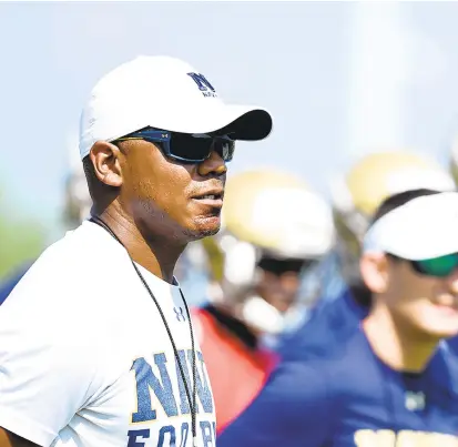  ?? PAUL W. GILLESPIE/CAPITAL GAZETTE ?? Two days after being fired, Navy’s Ivin Jasper, shown in 2017, was reinstated to the staff as quarterbac­ks coach.