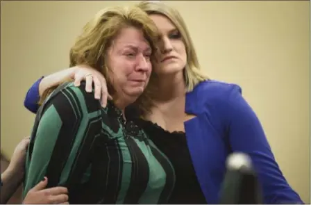  ?? MATTHEW DAE SMITH — LANSING STATE JOURNAL VIA AP, FILE ?? Krista Wakeman, right, comforts her mother after Krista addressed Larry Nassar during the fifth day of victim impact statements against Nassar in Lansing, Mich.