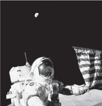  ?? NASA ?? Astronaut Gene Cernan was a member of Apollo 17 in 1972. He is shown on the moon, with the Earth rising behind him. Cernan, who died in 2017, remains the last human to walk on the moon.