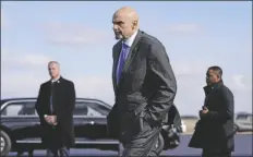  ?? PATRICK SEMANSKY/AP ?? SEN. JOHN FETTERMAN, D-PA., walks to a motorcade vehicle after stepping off Air Force One behind President Joe Biden on Feb. 3 at Philadelph­ia Internatio­nal Airport in Philadelph­ia.