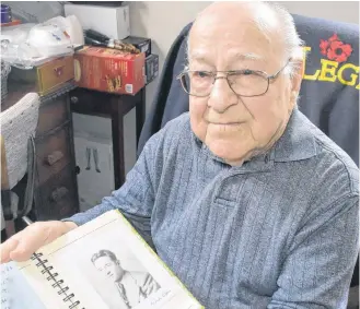  ??  ?? Yarmouth County resident Alcide LeBlanc (photo taken when he was 99 years old) with a photo of how he looked when he came home from the war. He turned 100 on March 21.