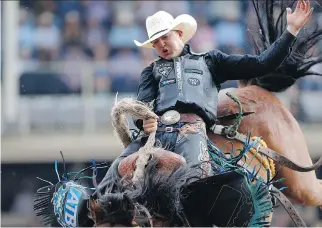  ?? LEAH HENNEL ?? Zeke Thurston of Big Valley rode Get Smart to his third straight saddle bronc championsh­ip at the Calgary Stampede last Sunday. He’s drawn Get Smart again for his ride on Friday night at the K-Days Rodeo.