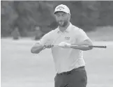  ?? JOHN MINCHILLO/AP ?? Jon Rahm reacts after missing a birdie putt on the 12th green in the third round of the Northern Trust tournament on Saturday in Jersey City, N.J.