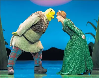  ??  ?? FAMILY SHOW: It normally takes two hours in make-up to transform Dean Chisnall into Shrek but for his first performanc­e there was 25 minutes.