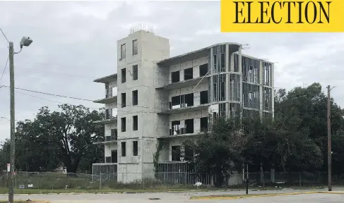  ?? CHRIS SELLEY / NATIONAL POST ?? At the corner of Newcastle and O streets in Brunswick, Ga., a five-storey concrete shell of a condo building stands as testament to an economic miscalcula­tion, writes Chris Selley. This coastal town was hit hard by the housing crash, losing 12.7 per...