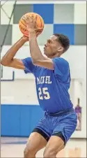  ?? Steven Eckhoff ?? Model’s Jakenes Heard sets up for a 3-point attempt during a game earlier this season.