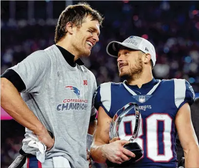  ?? DAVID J. PHILLIP / ASSOCIATED PRESS ?? arterback Tom Brady (left) and wide receiver Danny Amendola are back in the Super Bowl after leading the Patriots’ comeback. Amendola caught two scoring passes in the fourth quarter, including the winner with 2:48 to go.