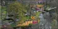  ?? PETER DEJONG — THE ASSOCIATED PRESS FILE ?? In this file photo, tourists visit Keukenhof spring garden in Lisse, some 20 kilometers from Amsterdam, Netherland­s.