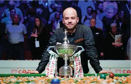  ?? Picture: Zac Goodwin/PA ?? Luca Brecel with the World Snooker Championsh­ip trophy