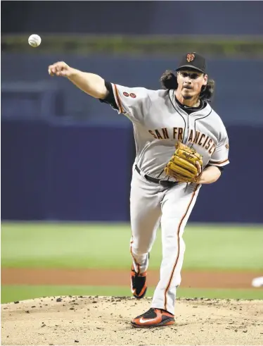  ?? DENIS POROY/GETTY IMAGES ?? Jeff Samardzija of the Giants allowed just four hits and struck out nine while walking none in blanking the Padres over seven.