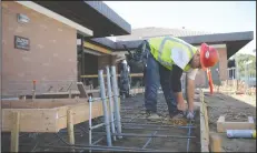  ?? BEA AHBECK/NEWS-SENTINEL ?? Abraham Rangel cuts rebar on Thursday as preparatio­ns are made for concrete to be poured on Monday as constructi­on continues at the Lodi Public Library.