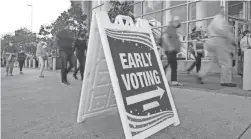  ?? CHRIS GRANGER/THE ADVOCATE VIA AP ?? Long lines wrap around the Smoothie King Center in New Orleans on Monday for one of the last days of early voting.