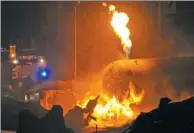  ?? SHI SONGSHE / XINHUA ?? A fire rages following explosions at two gas stations in Accra, Ghana, on Saturday night.