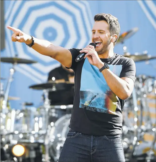  ??  ?? THEO WARGO/GETTY IMAGES
Luke Bryan says he’s drawn inspiratio­n from several live acts over the years, citing Ronnie Milsap, Alabama, Garth Brooks and Kenny Chesney as examples.