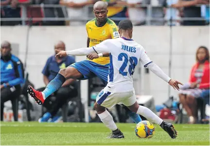  ?? /RICHARD HUGGARD/GALLO IMAGES ?? Chippa United’s Samuel Julies lines up a shot despite the attention from Sundowns defender Tebogo Langerman during their goalless draw in Port Elizabeth last Saturday.
