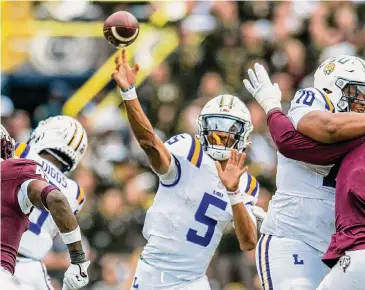  ?? Scott Clause/Associated Press ?? Jayden Daniels followed the path of so many QBs these days in transferri­ng. At LSU, Daniels won the Heisman Trophy and became a top NFL prospect, leading to him opting out of the ReliaQuest Bowl against Wisconsin.