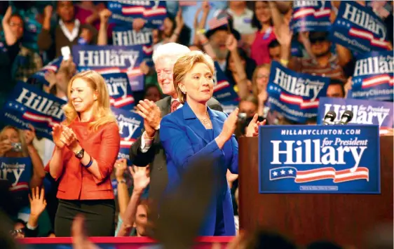  ?? (SIPA) ?? Bill Clinton stands behind his wife, Hillary, during one of her presidenti­al campaign rally in 2017.