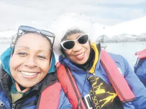  ?? — Sisters Traveling Solo photo ?? Women on a Sisters Traveling Solo trip kayak near glaciers in Antarctica in 2022.