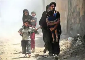  ??  ?? MOSUL: Iraqis flee from the Old City of Mosul yesterday during the ongoing offensive by Iraqi forces to retake the last district still held by the Islamic State (IS) group. — AFP