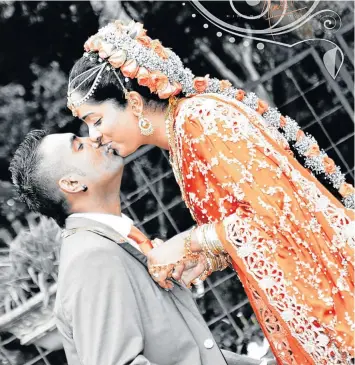  ??  ?? SEALING IT WITH A KISS: Dev and Tracy Govender on their wedding day