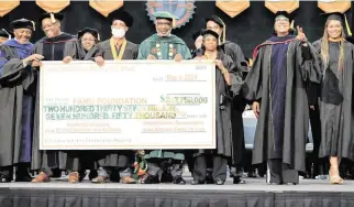  ?? ERNEST NELFRARD Courtesy Florida A&M University ?? Gregory Gerami (fourth from left), president and CEO of Batterson Farms Corp, recently announced a $237 million donation to Florida A&M University at school’s 2024 graduation ceremony.