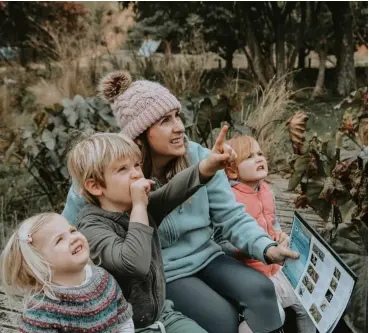  ?? ?? ABOVE: Esther Kilgour and family taking part in the 2021 NZ Garden Bird Survey.