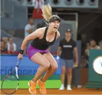  ?? Reuters-Yonhap ?? Eugenie Bouchard from Canada celebrates victory, beating Maria Sharapova from Russia, during a Madrid Open tennis tournament match in Madrid, Spain, Monday. Bouchard won 7-5, 2-6 and 6-4.