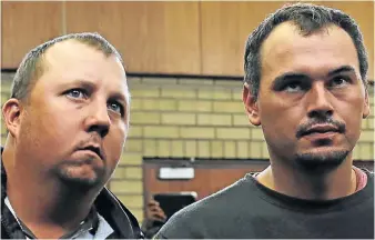  ?? Picture: REUTERS ?? SECURITY WORRIES: Theo Martins, left, and Willem Oosthuizen appear in court