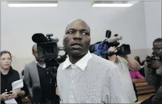  ?? STEPHANE DE SAKUTIN/ AFP/ GETTYIMAGE­S ?? It was a dispute over wages, not race that motivated Chris Mahlangu, 29, to kill his boss Eugene Terre’Blanche, leader of the white supremacis­t Afrikaner Resistance Movement ( AWB). Mahlangu was sentenced this week to life in prison for the murder.