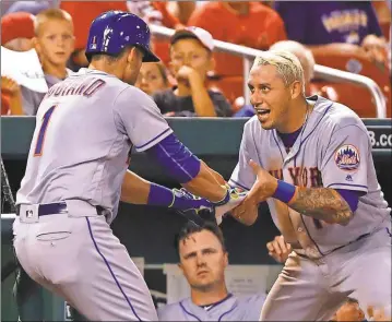  ?? The Associated Press ?? Billy Hurst / New York’s Justin Ruggiano (left) is congratula­ted by Asdrubal Cabrera after hitting a home run during Tuesday’s game.