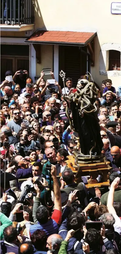  ??  ?? Every year a wooden statue of St Dominic covered
in live snakes is paraded through Cocullo – usual population 250 – attended
by a crowd of about 30,000