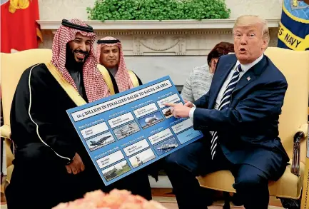  ?? PHOTO: AP ?? President Donald Trump shows a chart highlighti­ng arms sales to Saudi Arabia during a meeting with Crown Prince Mohammed bin Salman yesterday.