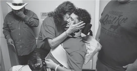  ?? Godofredo A. Vasquez / Staff Photograph­er ?? D.J. Anzaldua is kissed by his grandmothe­r, Hilda, as he is released from Memorial Hermann Hospital in July.