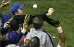  ?? ASSOCIATED PRESS FILE PHOTO ?? Bartman deflects the foul ball in front of Moises Alou.