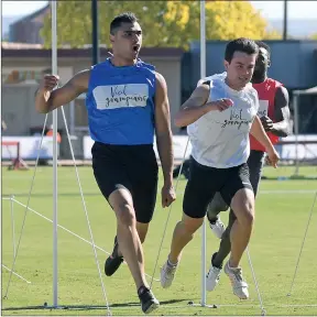  ??  ?? PUMPED UP: Dhruv Rodrigues Chico, left, celebrates as he crosses the line ahead of Leonard King to claim the $40,000 Stawell Gift men’s final on Monday.