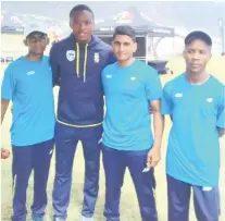  ??  ?? Proteas bowling star Kagiso Rabada, second left, with teenage pace bowlers Kovilan Pillay, Fahyaaz Rahiman and Xolani Shezi at the Cape Town final of the Audi Q5 Fast Track, an initiative by Cricket South Africa to unearth fast-bowling talent.