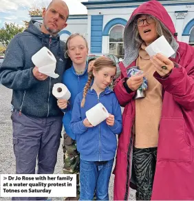  ?? ?? Dr Jo Rose with her family at a water quality protest in Totnes on Saturday