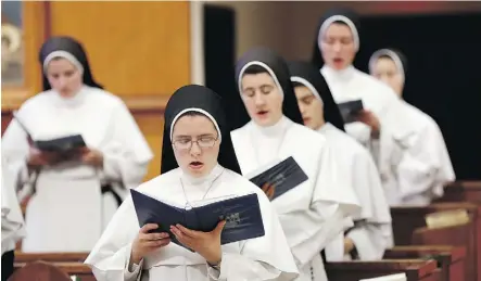  ?? THE ASSOCIATED PRESS ?? With simple faith-themed songs — some traditiona­l, some obscure and some original — the members of Dominican Sisters of Mary, Mother of the Eucharist are topping Billboard’s classical chart.