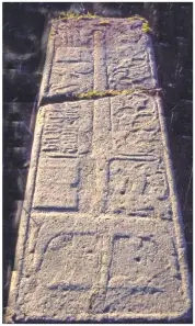  ?? Photograph­s: Iain Thornber ?? Kilmory graveyard, Rum, where Malcolm Maclean is buried. The wall has been repaired since the photograph was taken. And, above, one of many old gravestone­s on Mull dominated by a sword.