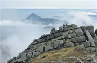  ?? Photograph: Alastair Howe. ?? Two mountain festival walkers on the south ridge of Goatfell.