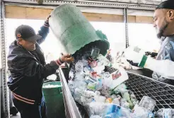  ?? Michael Short / Special to The Chronicle ?? Pablo Mendoza dumps recyclable­s at Our Planet Recycling in S.F., one of the few redemption centers left open in the city.